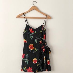 Kimchi Blue Black floral romper. Faux wrap squi